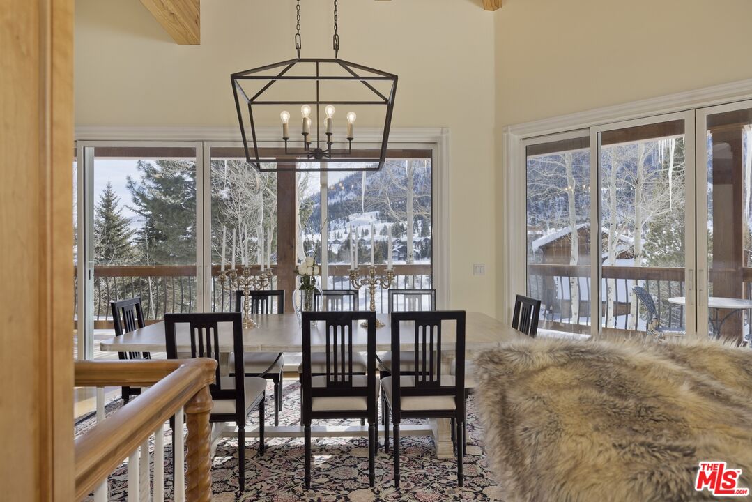 370 Ranch Road Mammoth Lakes, CA 93546 - Photo 11 of 38 a view of a dining room with furniture window and outside view