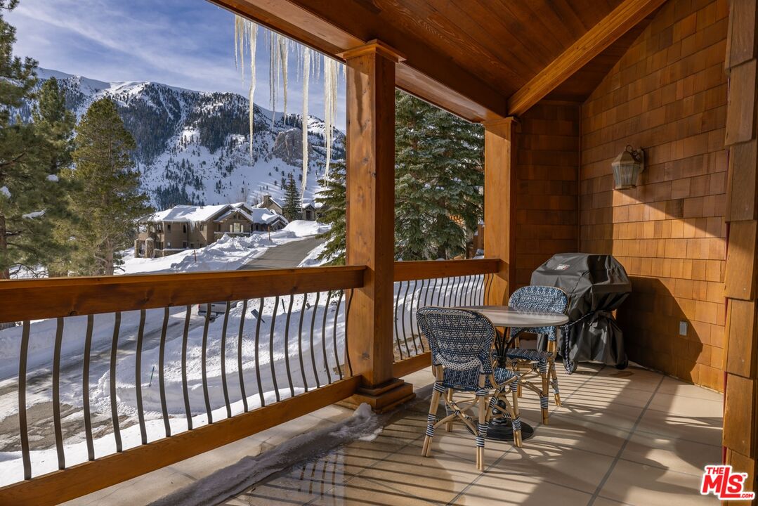 370 Ranch Road Mammoth Lakes, CA 93546 - Photo 14 of 38 a view of a chairs and table in the balcony