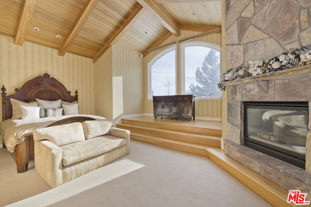 370 Ranch Road Mammoth Lakes, CA 93546 - Photo 23 of 38 a living room with furniture and a fireplace