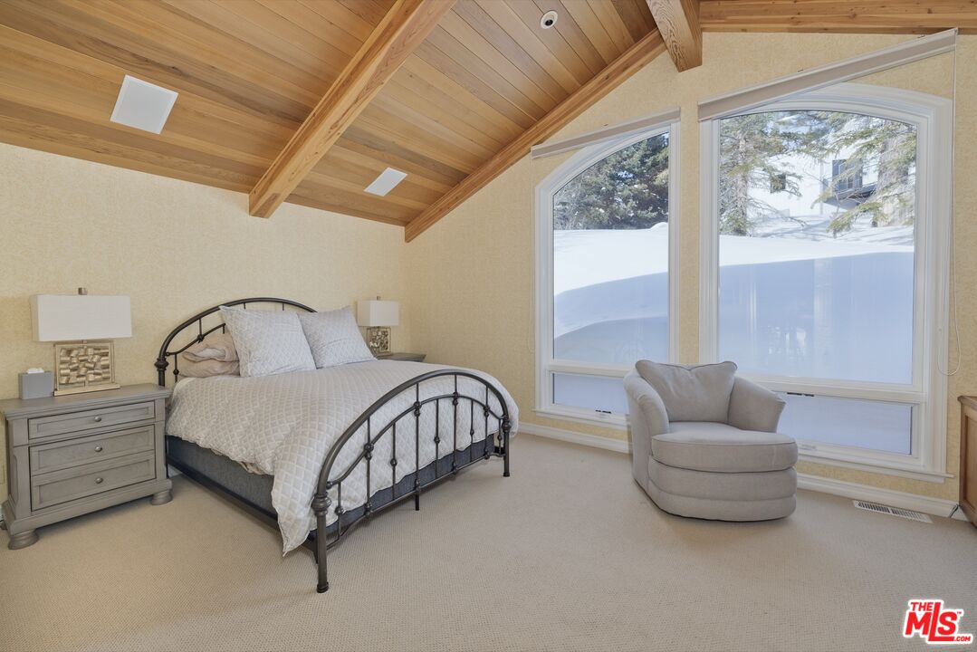 370 Ranch Road Mammoth Lakes, CA 93546 - Photo 31 of 38 a bedroom with a bed and glass window