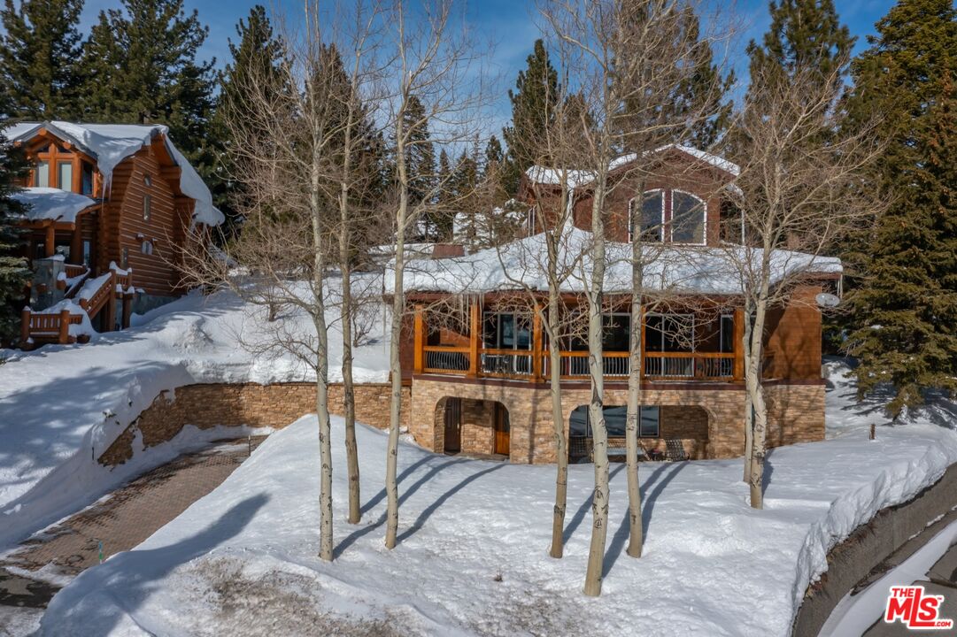 370 Ranch Road Mammoth Lakes, CA 93546 - Photo 36 of 38 a view of a house with backyard porch and sitting area