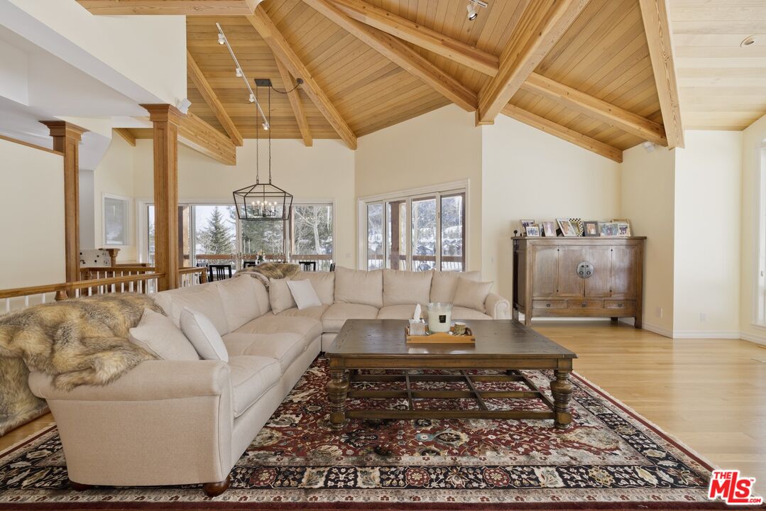 370 Ranch Road Mammoth Lakes, CA 93546 - Photo 4 of 38 a living room with furniture and a rug