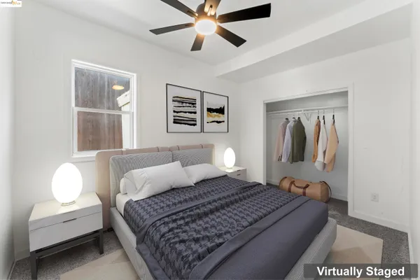 a bedroom with a large bed and a window