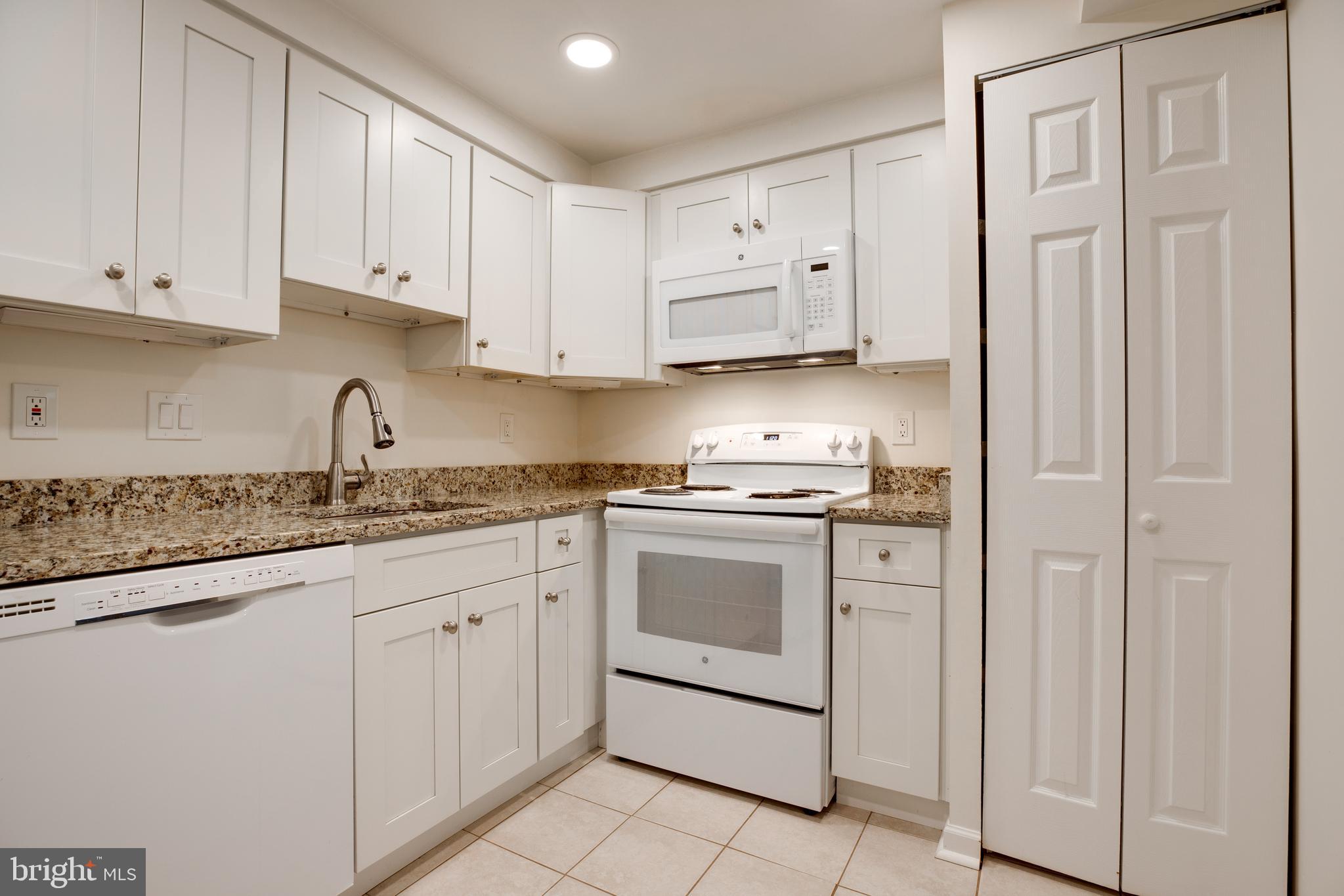 7651 Tremayne Place, Unit 202 McLean, VA 22102 - Photo 16 of 59 Kitchen with Granite Counters