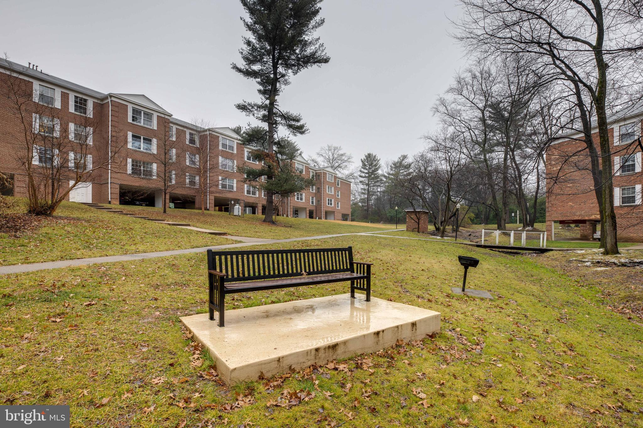7651 Tremayne Place, Unit 202 McLean, VA 22102 - Photo 34 of 59 Park-like Setting behind Bldg with Benches & BBQ