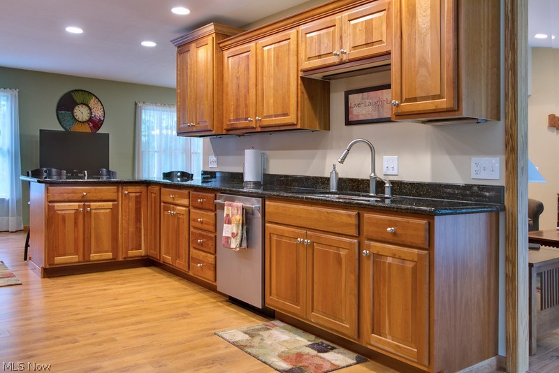 4675 Richman Road Litchfield, OH 44253 - Photo 4 of 30 Stainless steel appliances, granite countertops and bar-type seating area are just a few features of the open concept kitchen.