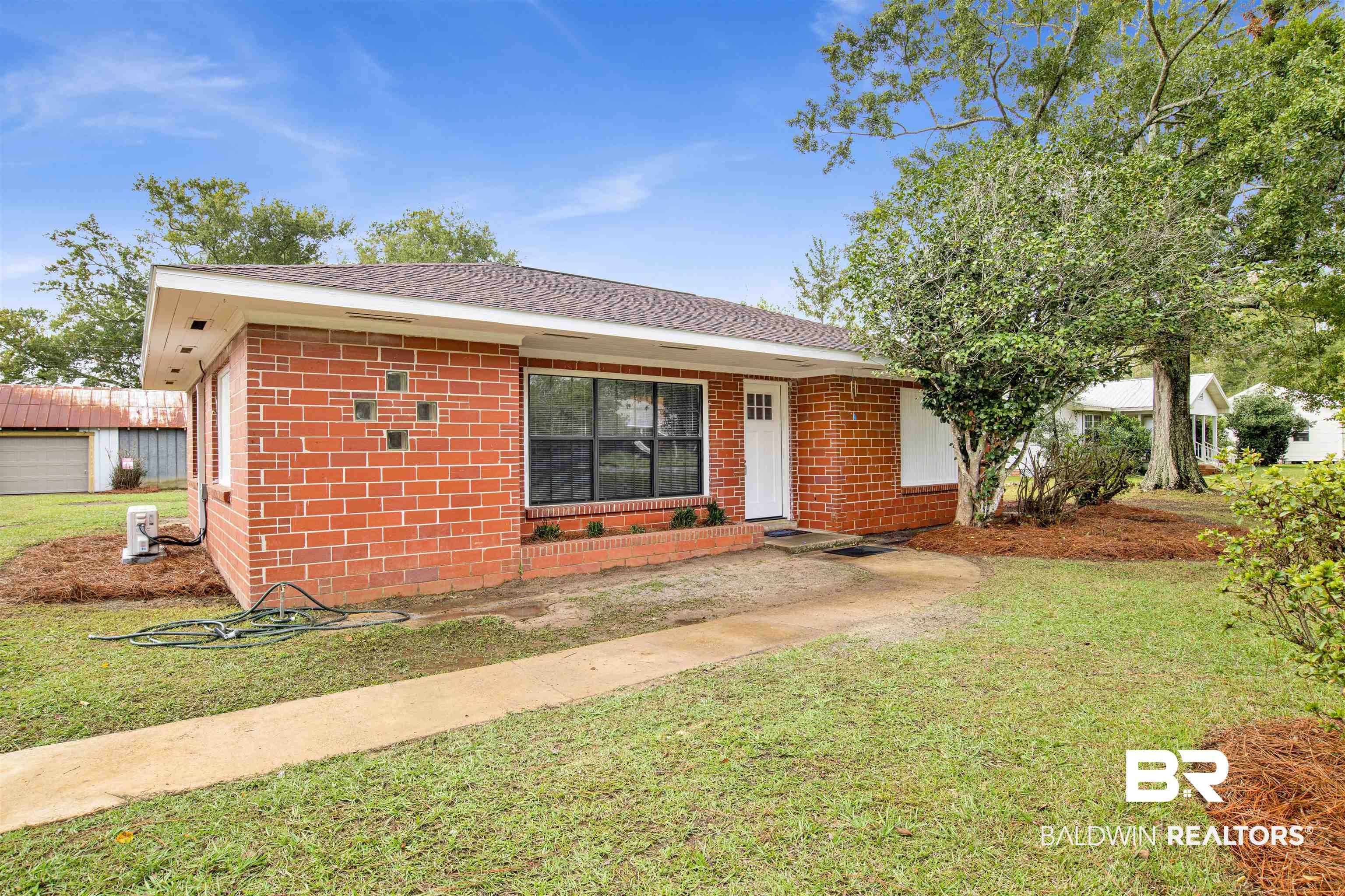 311 West Myrtle Avenue Foley, AL 36535 - Photo 3 of 22 Ranch-style house featuring a front lawn