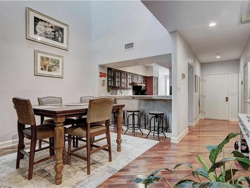 1926 Harbourside Drive, Unit 1302 Longboat Key, FL 34228 - Photo 11 of 31 a view of a dining room with furniture