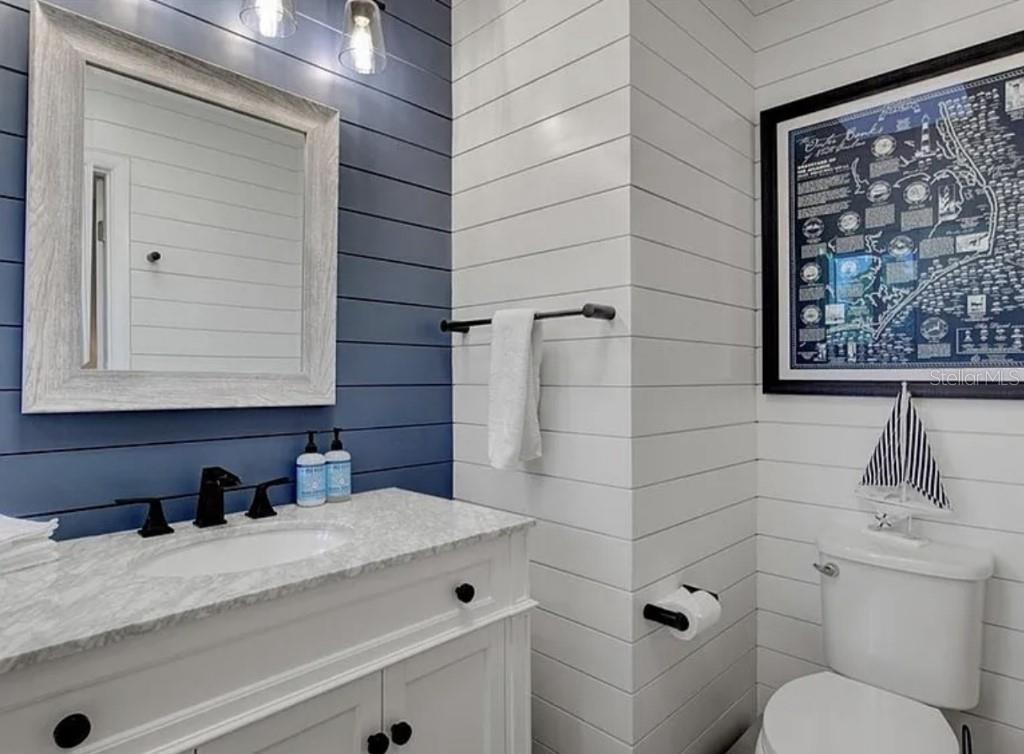 1926 Harbourside Drive, Unit 1302 Longboat Key, FL 34228 - Photo 18 of 31 a bathroom with a granite countertop sink toilet and shower