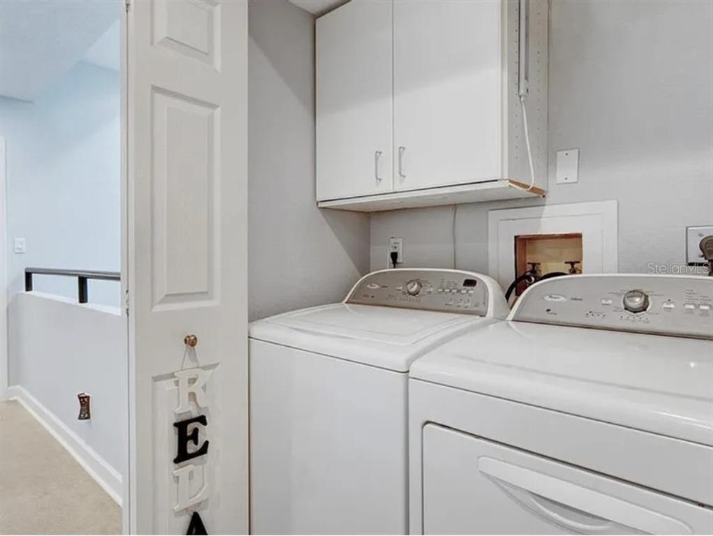 1926 Harbourside Drive, Unit 1302 Longboat Key, FL 34228 - Photo 10 of 31 a utility room with dryer and washer