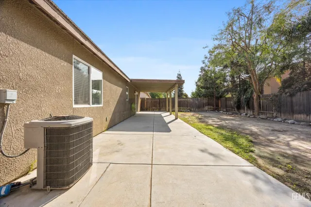 a view of backyard with a table and chairs