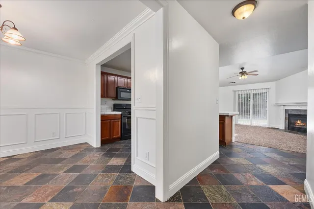 a view of a hallway to rooms and stairs