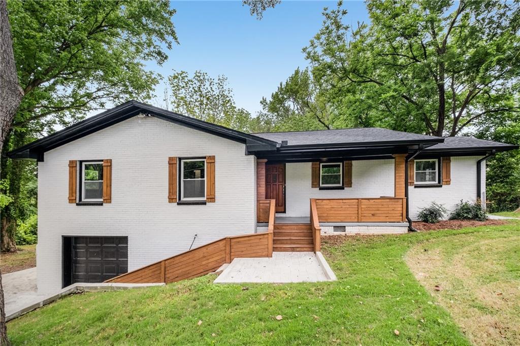 3647 Rockbridge Road Southwest Decatur, GA 30032 - Photo 1 of 1 a front view of a house with a yard