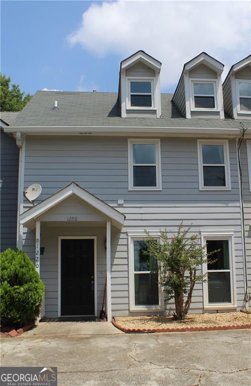 1220 Kennesaw Trace Court Kennesaw, GA 30144 - Photo 1 of 21 a front view of a house