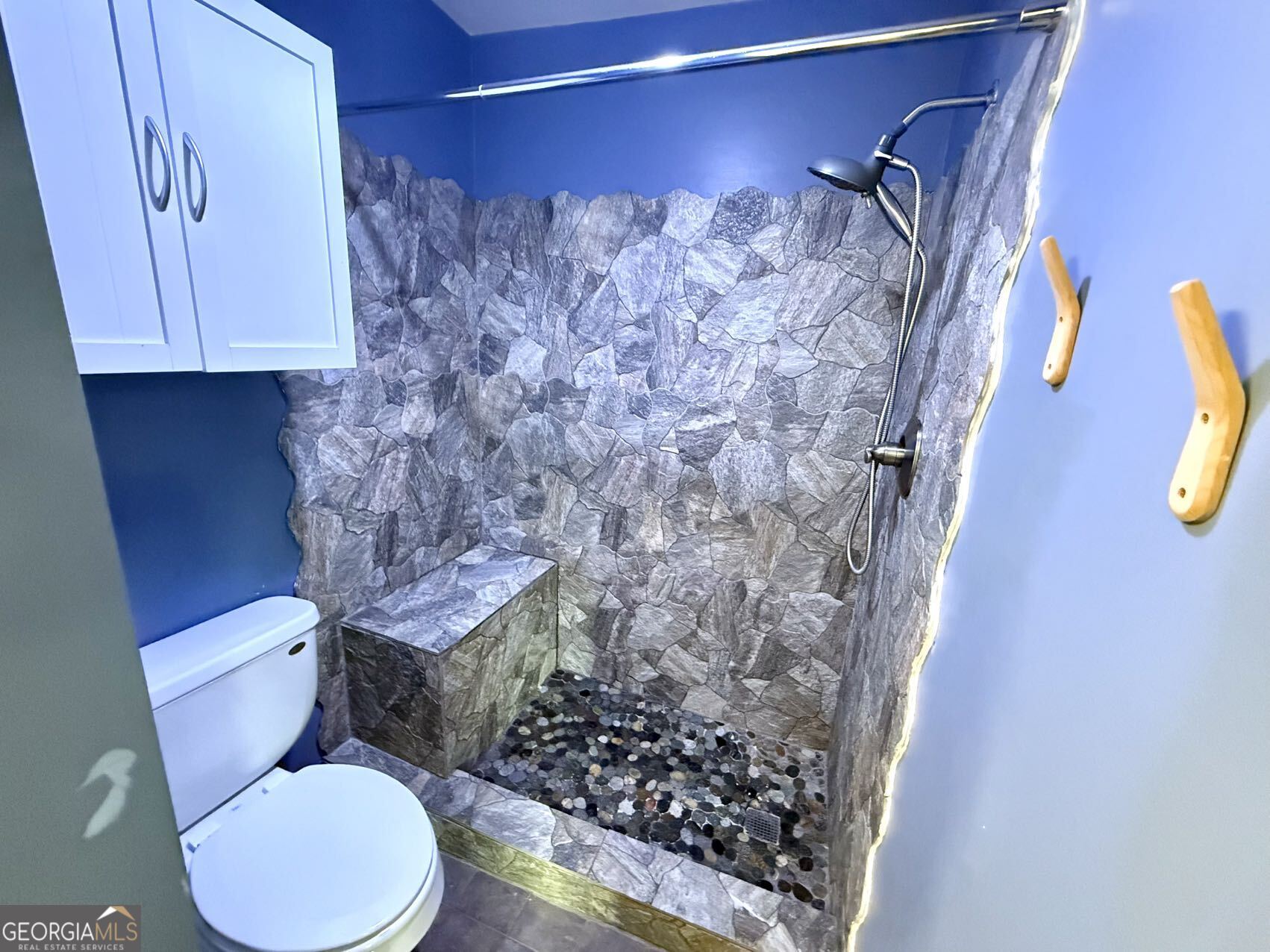 1220 Kennesaw Trace Court Kennesaw, GA 30144 - Photo 13 of 21 a white toilet sitting next to a shower curtain