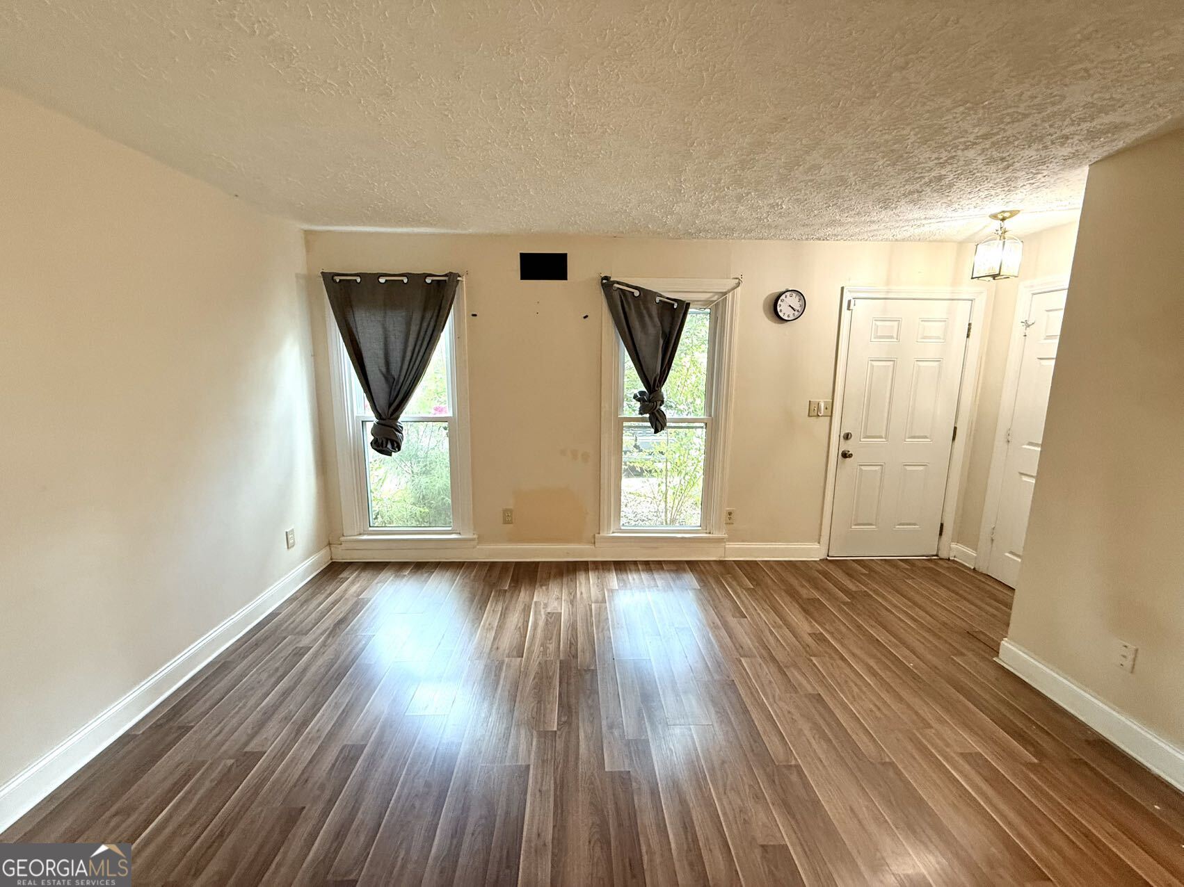 1220 Kennesaw Trace Court Kennesaw, GA 30144 - Photo 3 of 21 a view of empty room with wooden floor and fan