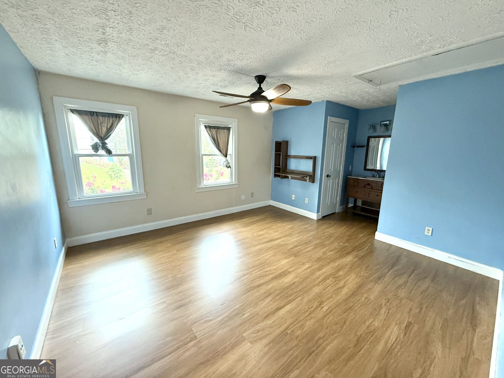 1220 Kennesaw Trace Court Kennesaw, GA 30144 - Photo 10 of 21 wooden floor in an empty room with a window