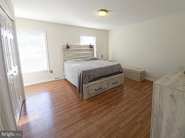 a room with a bed and window