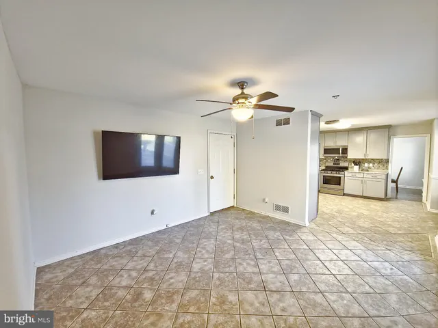 a view of a livingroom with furniture and chandelier