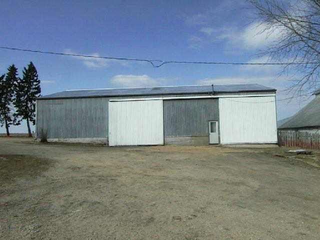 23893 Cyclone Ridge Road Lanark, IL 61046 - Photo 4 of 5 a view of large parking space and a garage