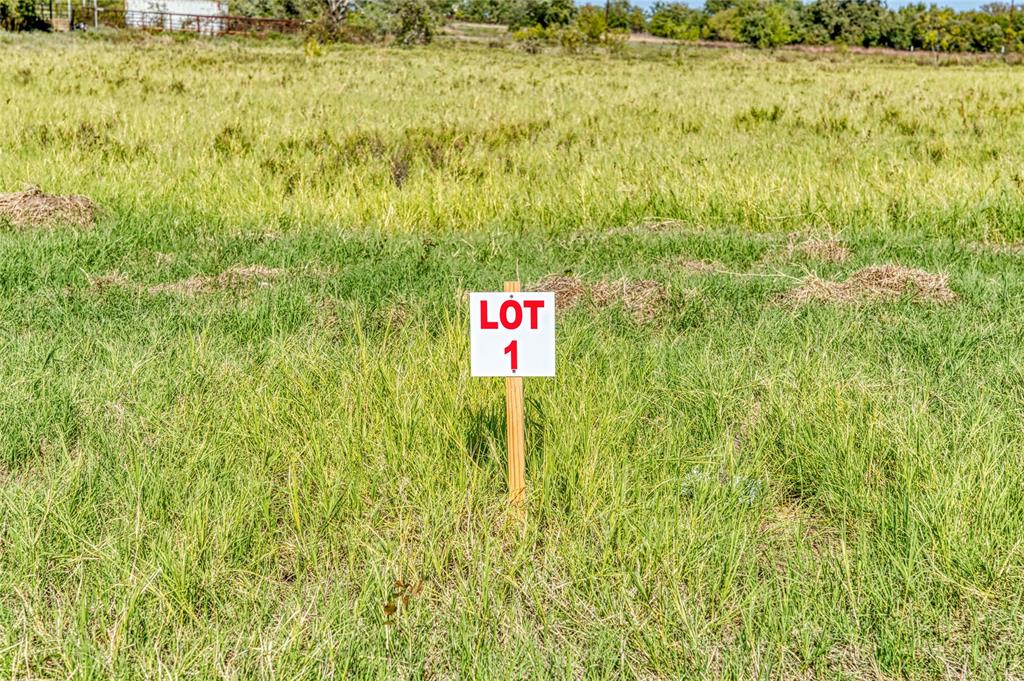 Tbd Wilson Road Perrin, TX 76486 - Photo 5 of 30 a sign that is sitting in the grass near an outdoor space