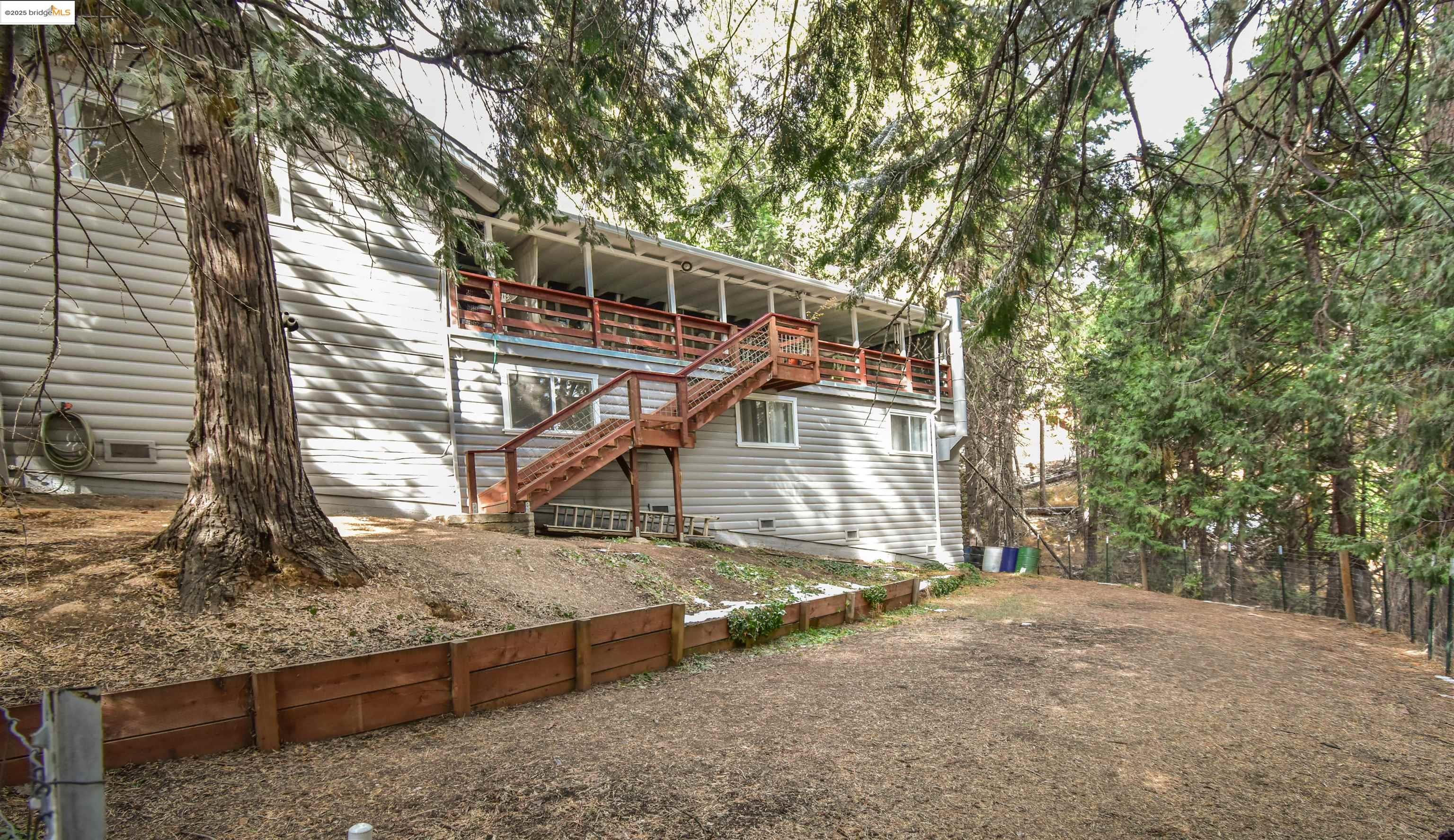 20705 Muheli Road Mi Wuk Village, CA 95346 - Photo 18 of 18 Back of house with fenced yard
