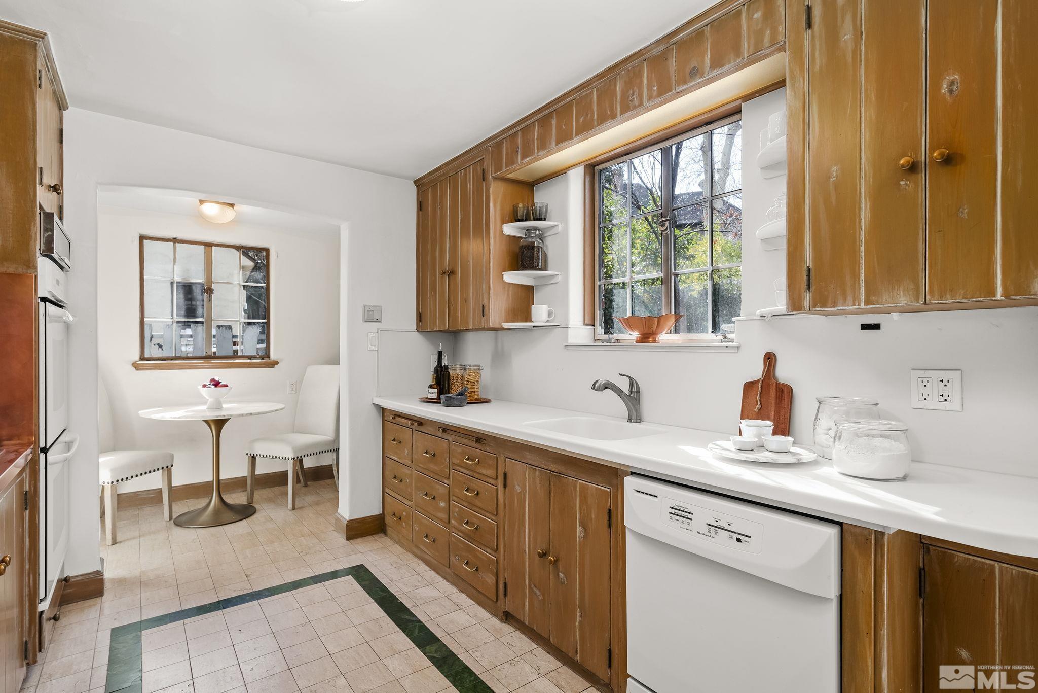 751 Marsh Avenue Reno, NV 89509 - Photo 18 of 39 a kitchen with a sink a counter top space and living room area