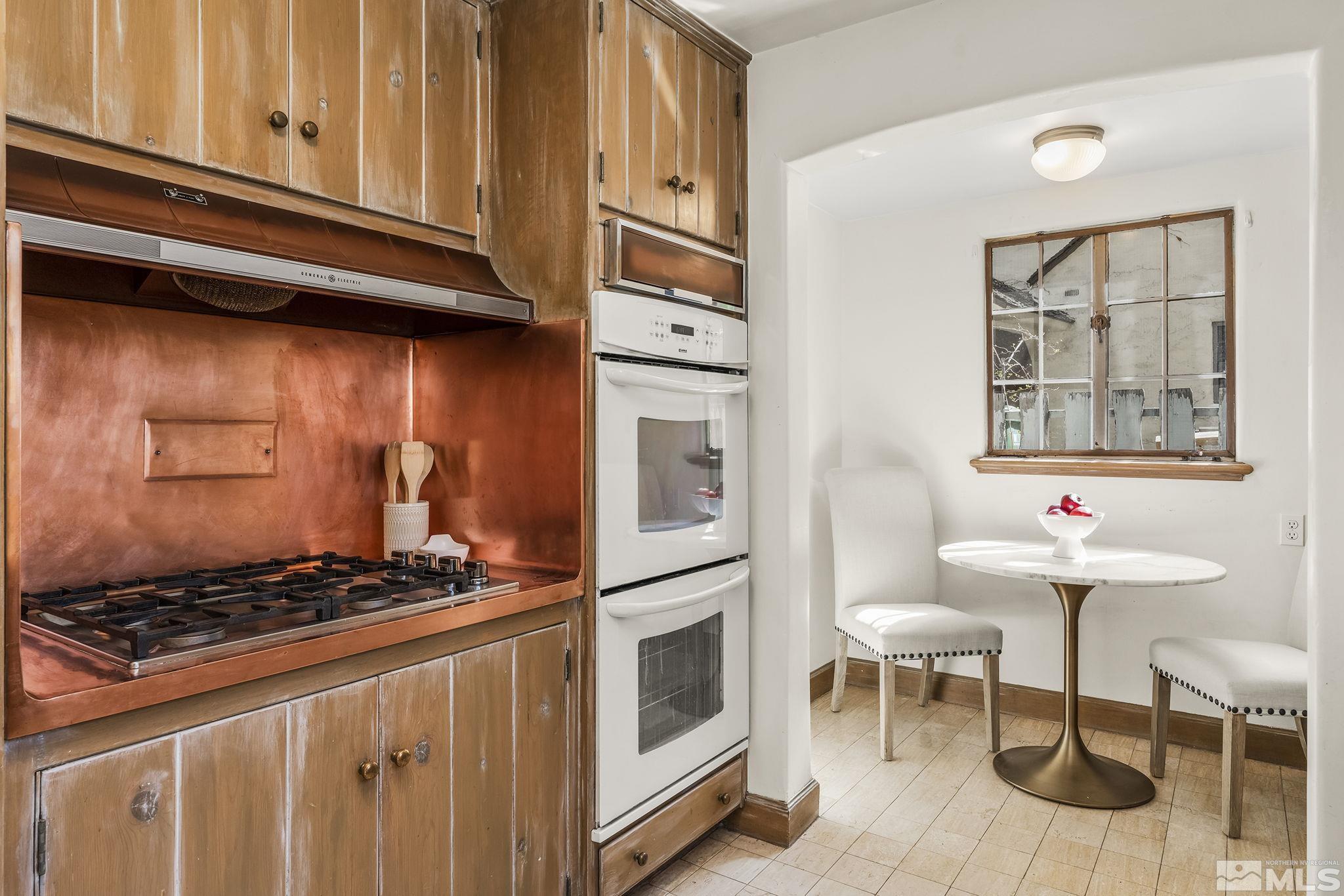 751 Marsh Avenue Reno, NV 89509 - Photo 19 of 39 a kitchen with stainless steel appliances granite countertop a stove and a refrigerator