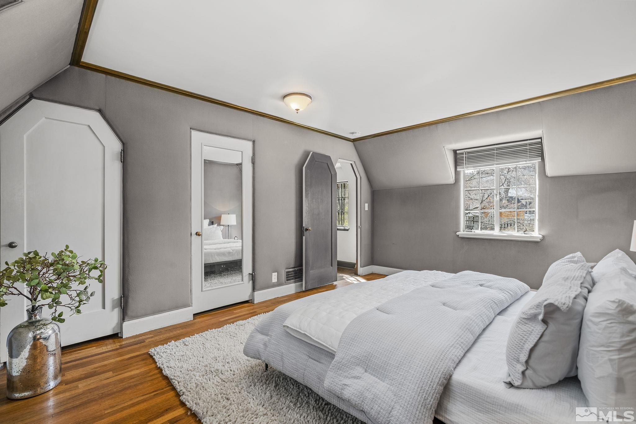 751 Marsh Avenue Reno, NV 89509 - Photo 24 of 39 a bedroom with a bed and a potted plant