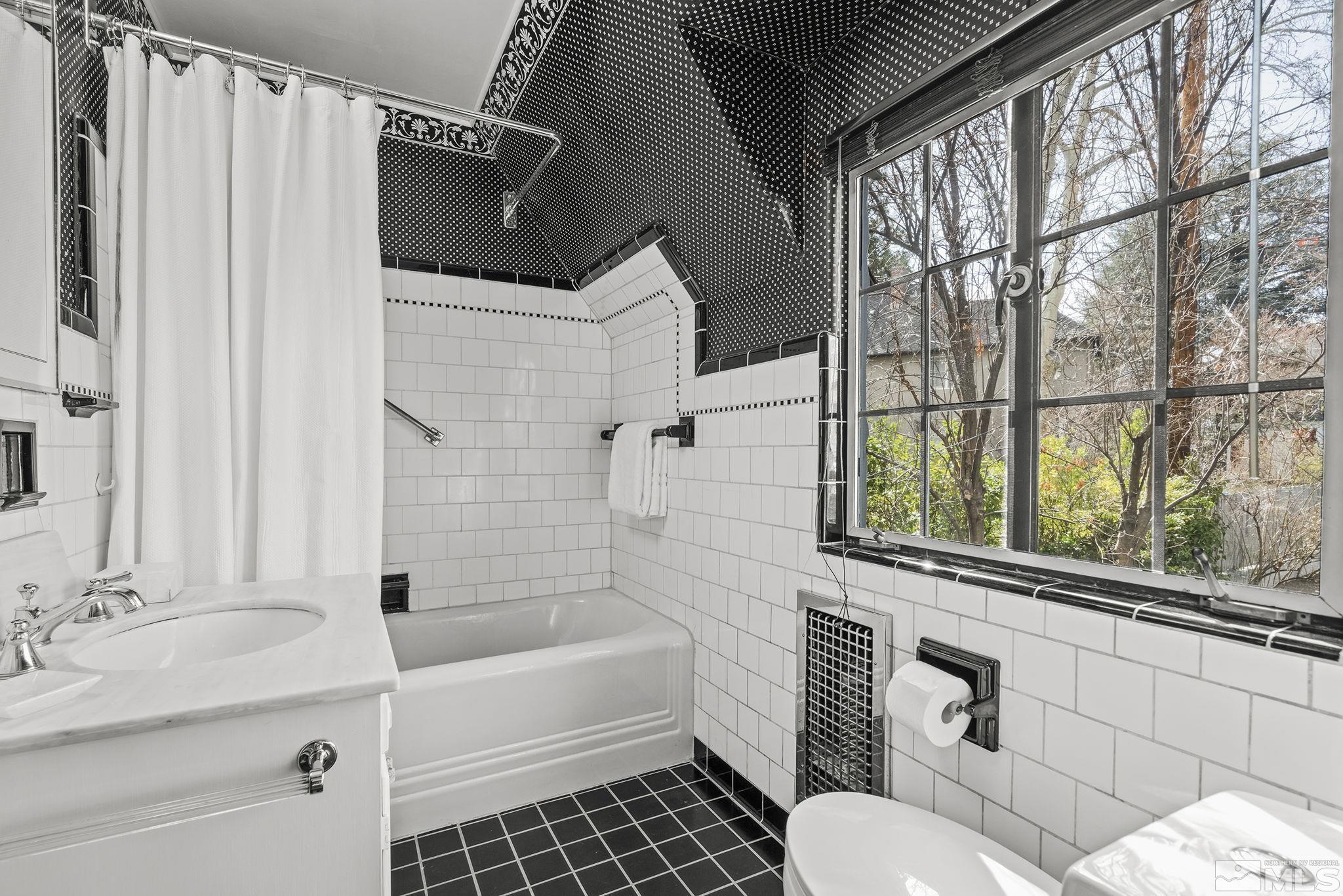 751 Marsh Avenue Reno, NV 89509 - Photo 25 of 39 a bathroom with a sink toilet and shower
