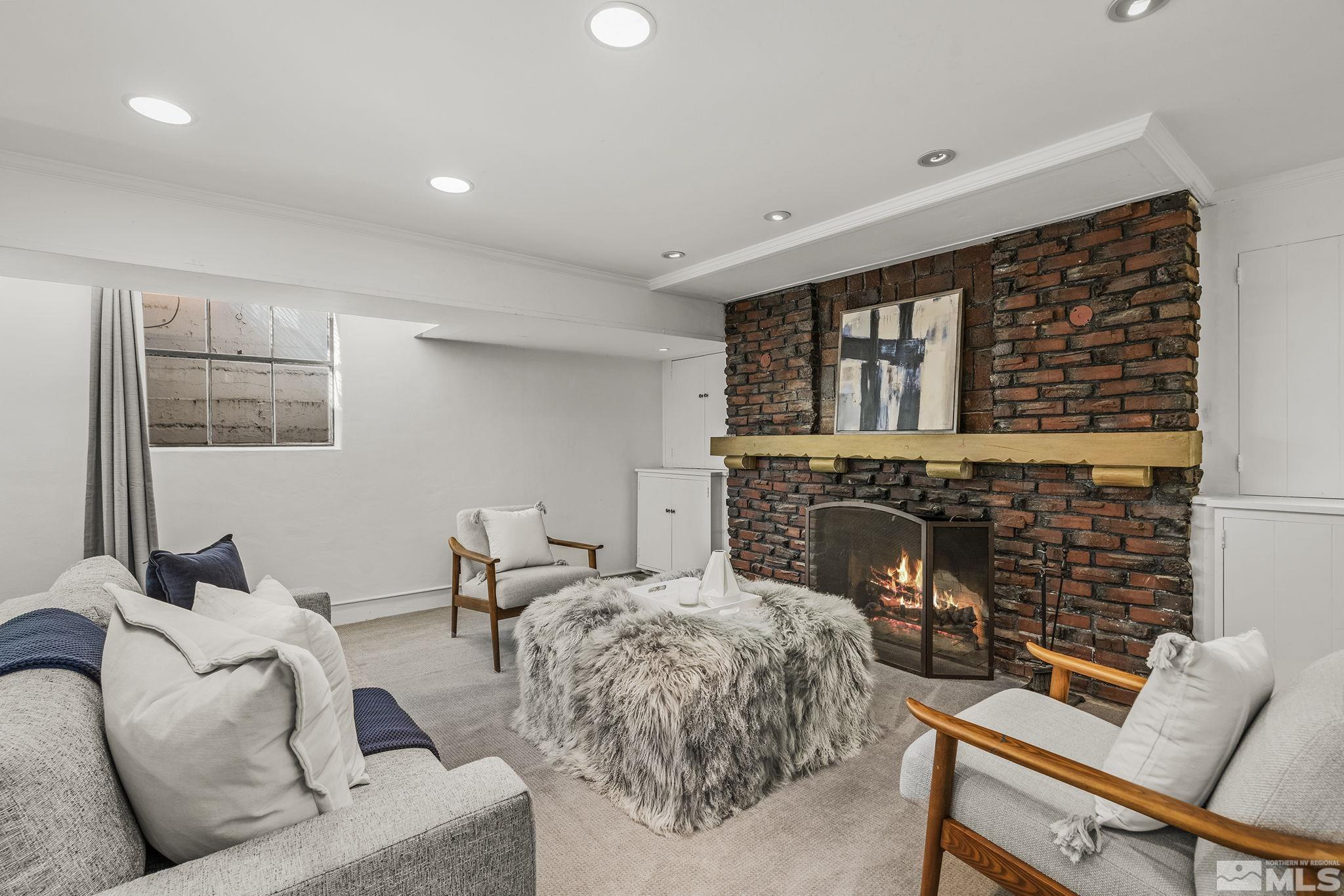 751 Marsh Avenue Reno, NV 89509 - Photo 29 of 39 a living room with furniture windows and a fireplace
