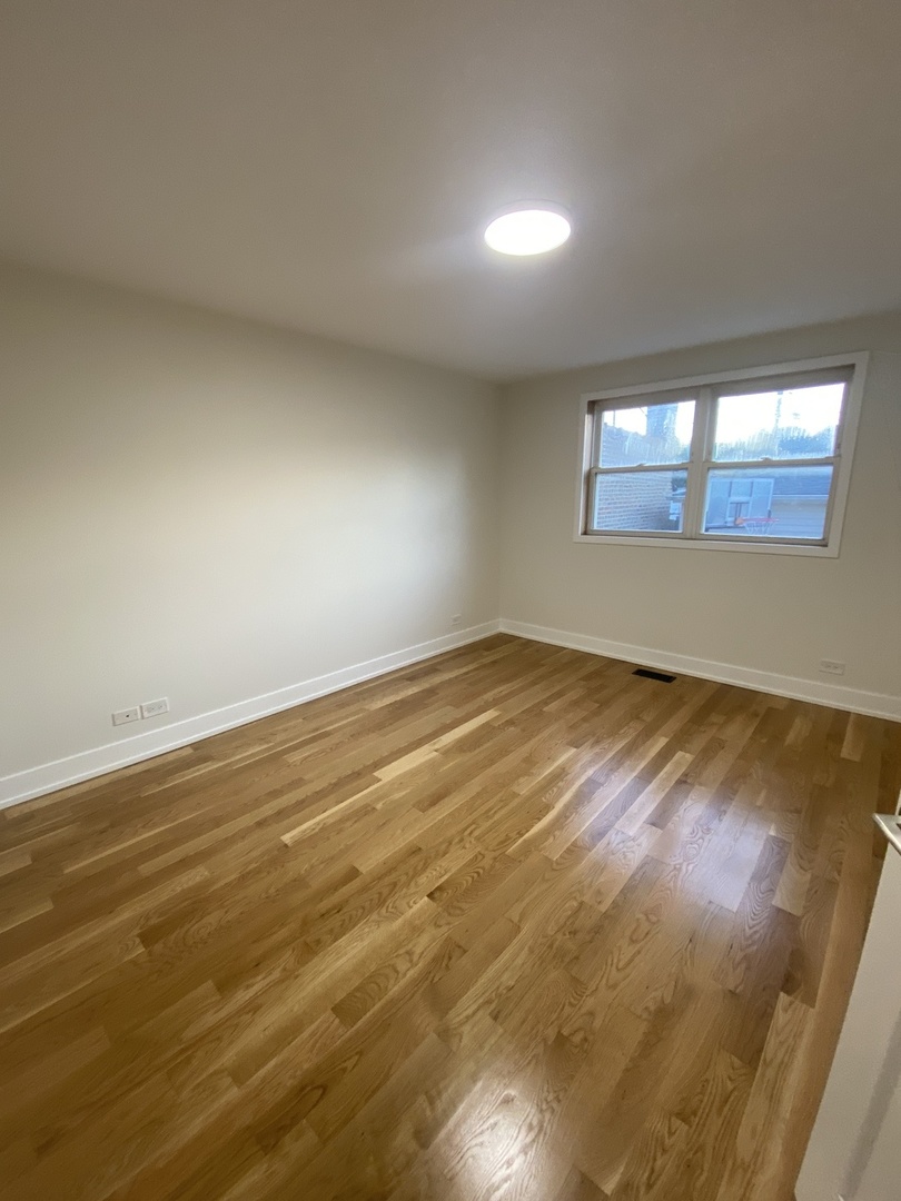 3270 North Elston Avenue, Unit 1 Chicago, IL 60618 - Photo 12 of 13 a view of empty room with window