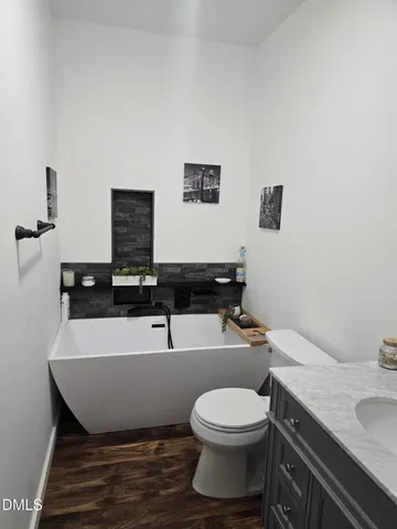 a room with a toilet and a sink