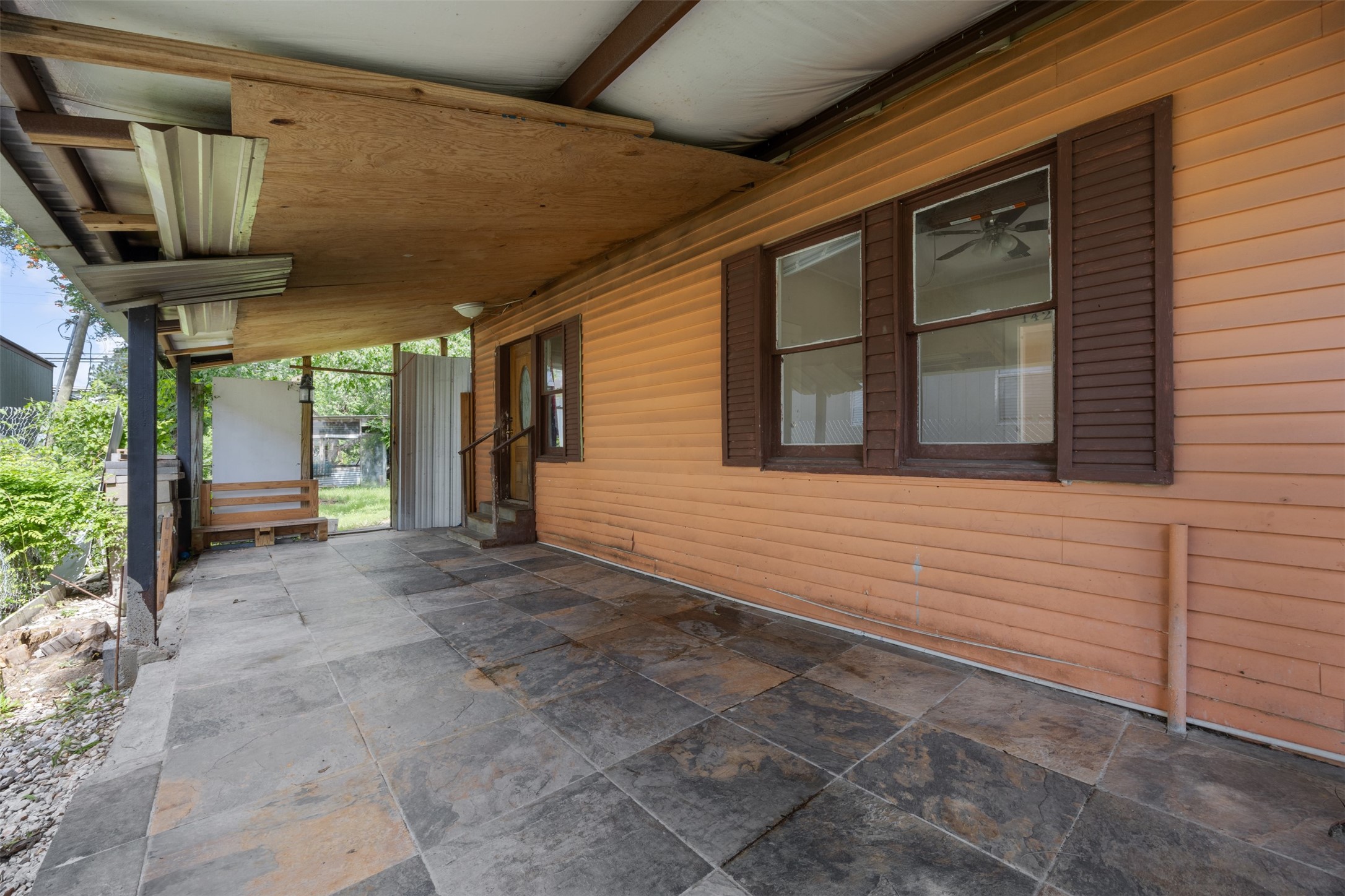 1410 8th Street Rosenberg, TX 77471 - Photo 19 of 25 a view of a house with window and wooden fence