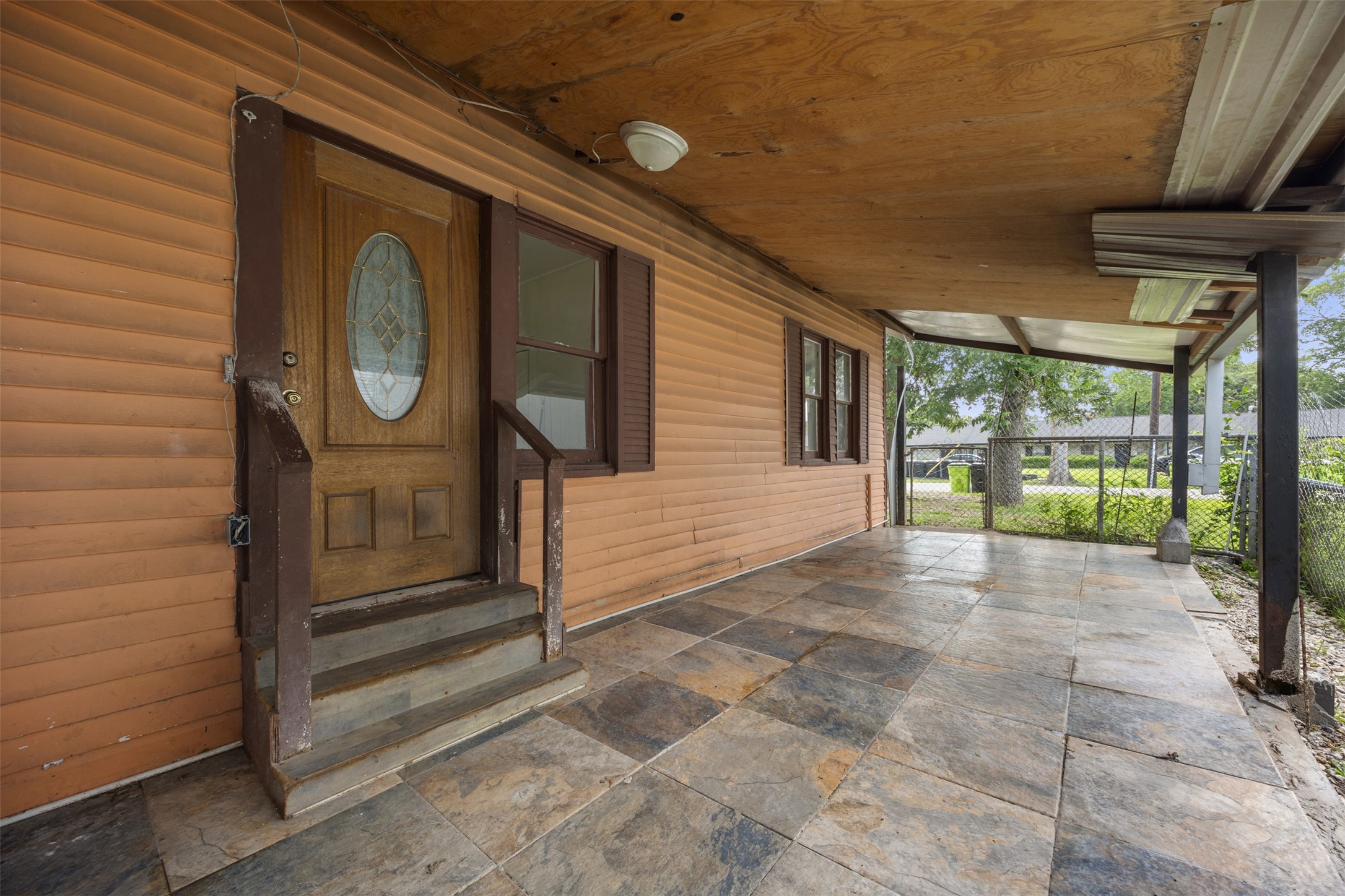 1410 8th Street Rosenberg, TX 77471 - Photo 20 of 25 a view of a pathway of a house with a large window