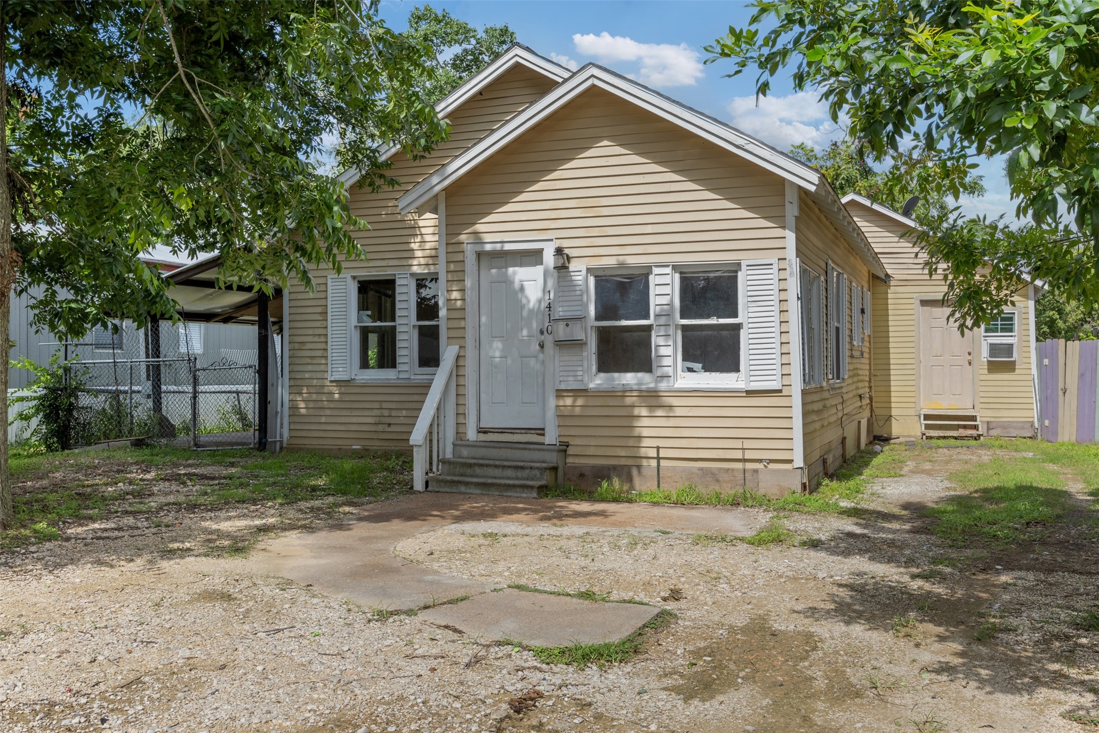 1410 8th Street Rosenberg, TX 77471 - Photo 2 of 25 a view of a house with a yard