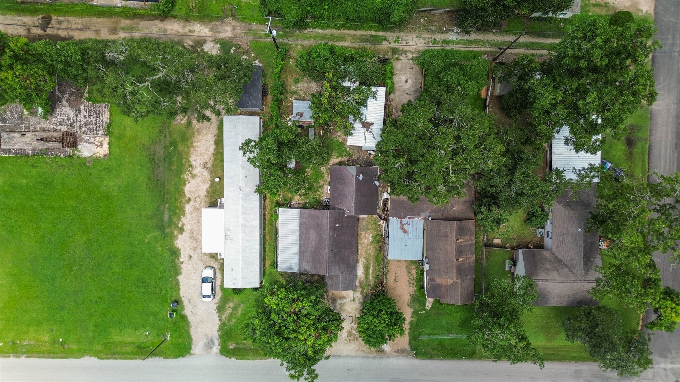 1410 8th Street Rosenberg, TX 77471 - Photo 22 of 25 an aerial view of a house with pool outdoor seating and yard