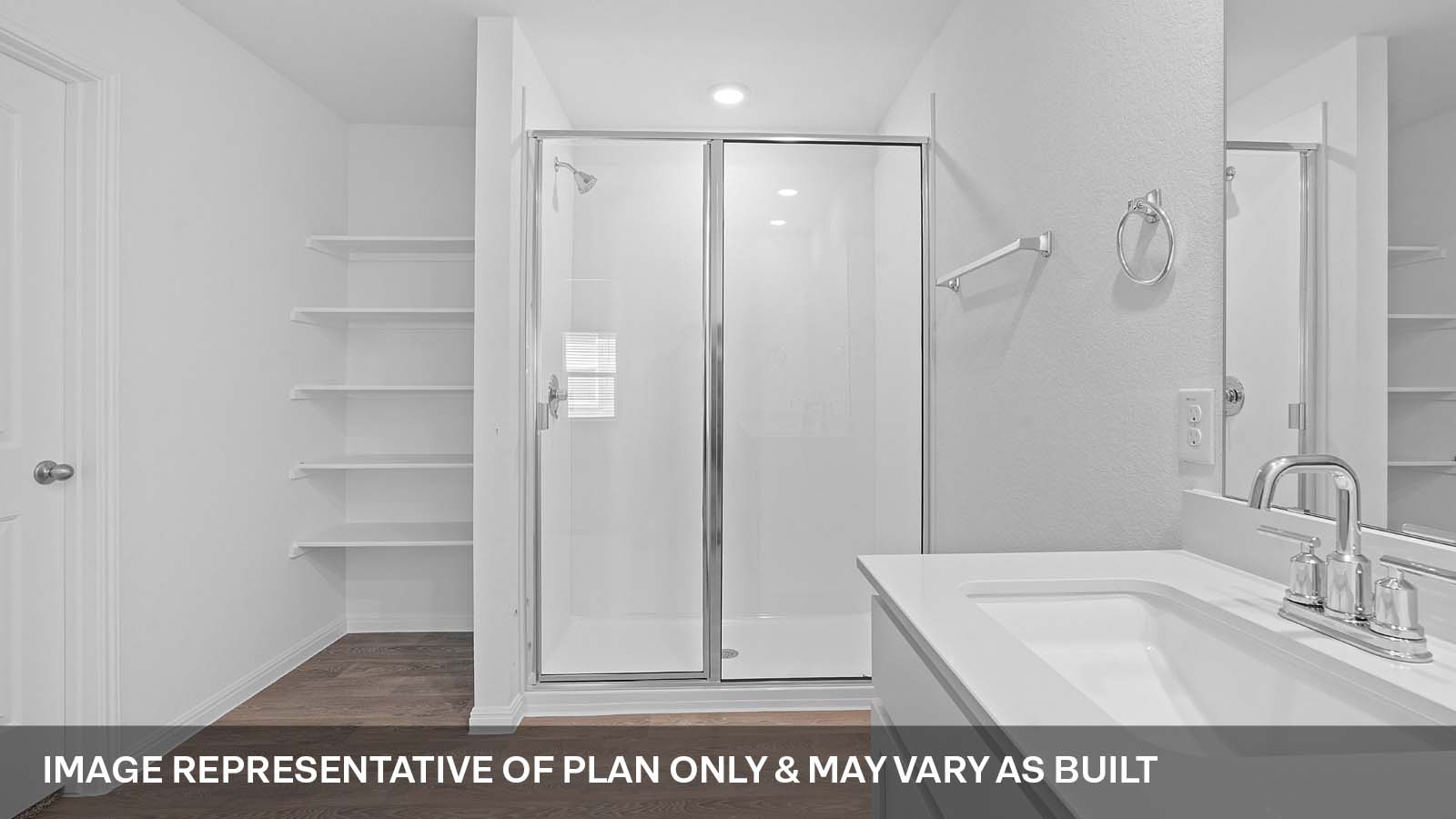 275 Mountain Pea Road Kyle, TX 78640 - Photo 12 of 22 a bathroom with a sink a mirror and a shower