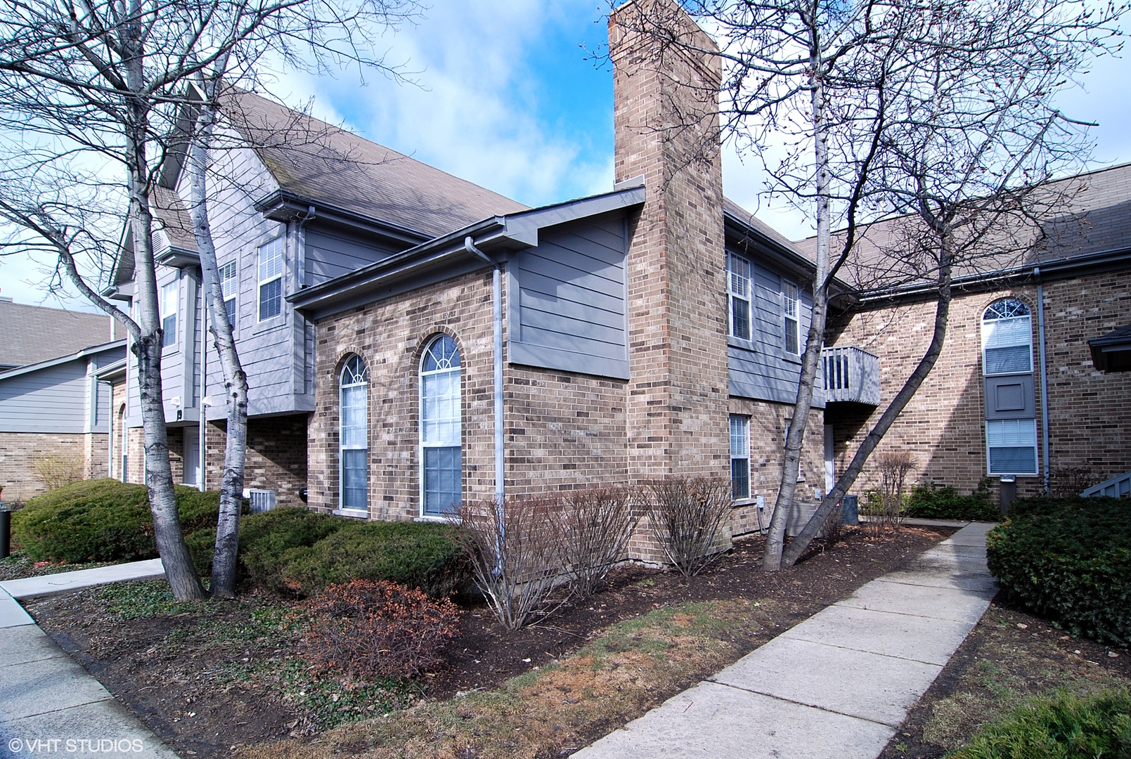 19 Foxcroft Road, Unit 219 Naperville, IL 60565 - Photo 1 of 14 a view of a house with a street