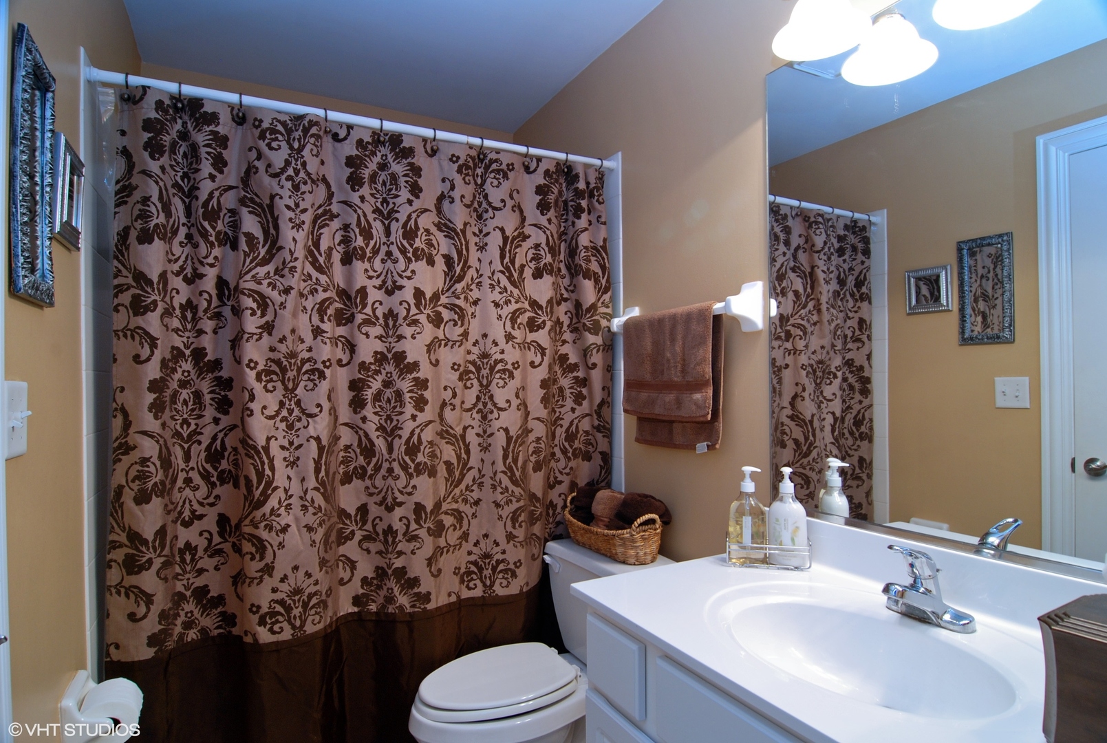 19 Foxcroft Road, Unit 219 Naperville, IL 60565 - Photo 8 of 14 a bathroom with a sink toilet and shower
