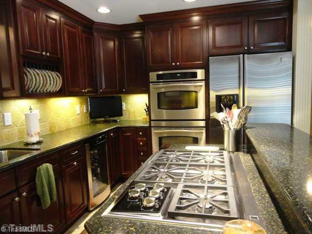 1212 Gatehouse Road High Point, NC 27262 - Photo 5 of 16 Kitchen. Stainless steel appliances, Wolf - 5 burner gas range, Double ovens.