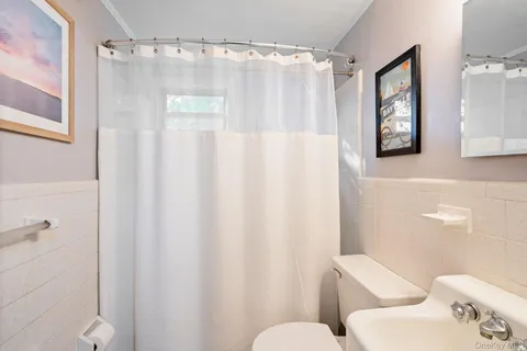 a view of backyard of house with green space