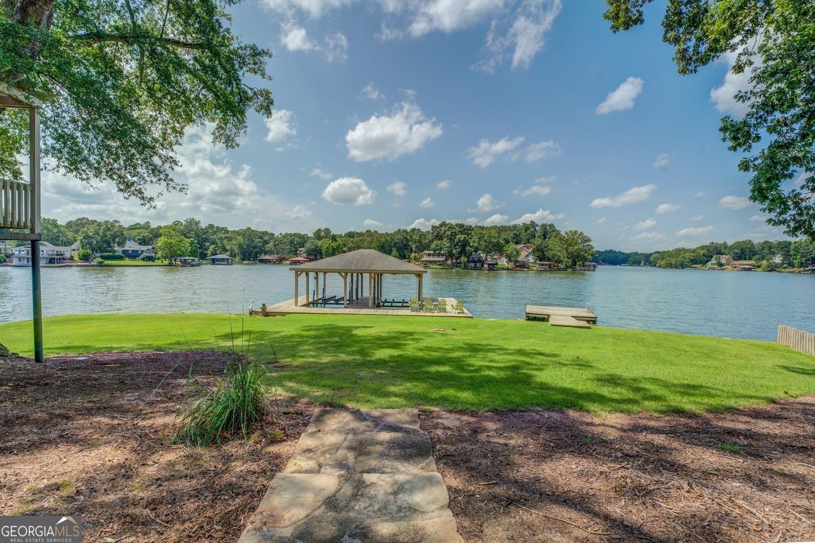 393 Templeton Road Mansfield, GA 30055 - Photo 14 of 54 a view of a lake with a garden