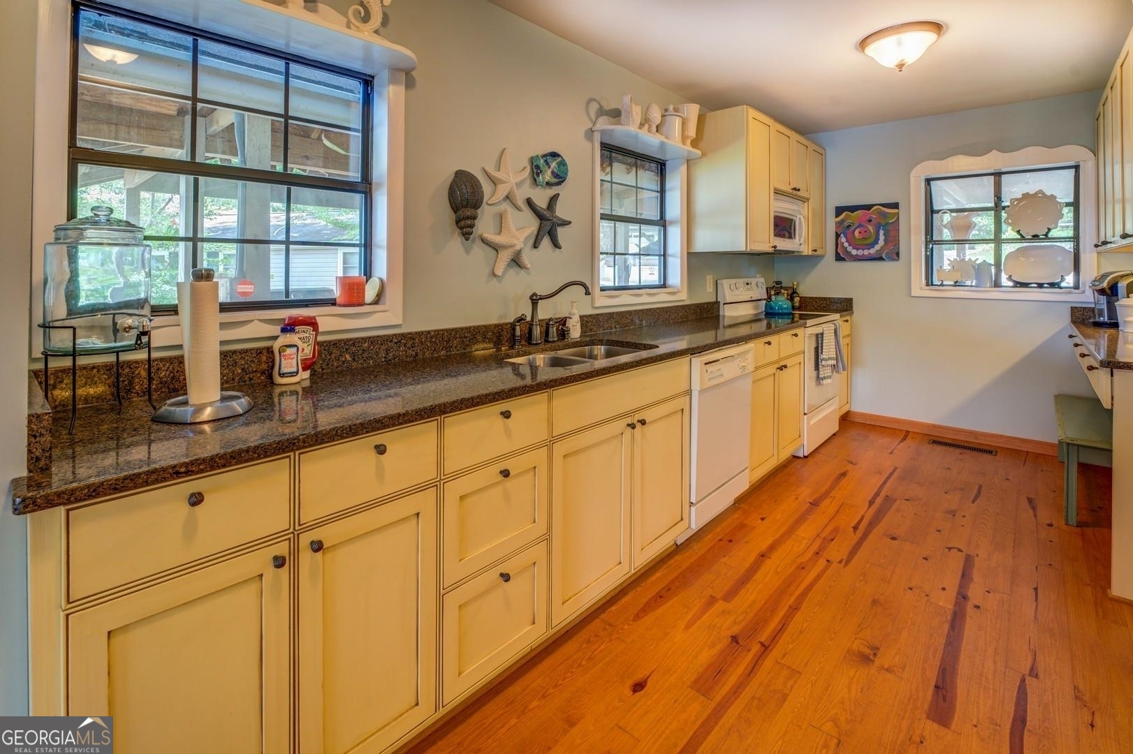 393 Templeton Road Mansfield, GA 30055 - Photo 25 of 54 a large kitchen with granite countertop a large window and stainless steel appliances
