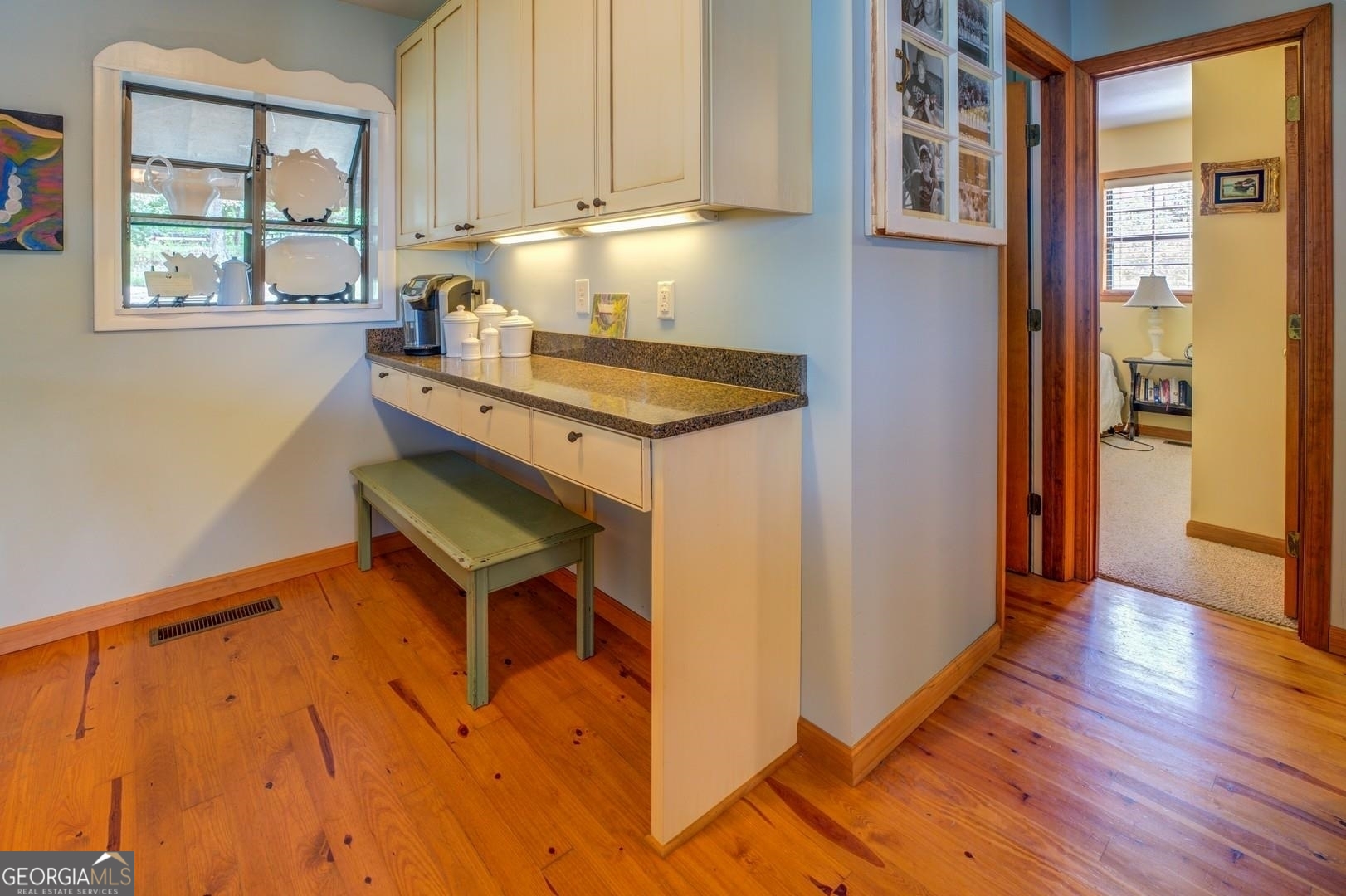 393 Templeton Road Mansfield, GA 30055 - Photo 27 of 54 a kitchen with a wooden floor and a window