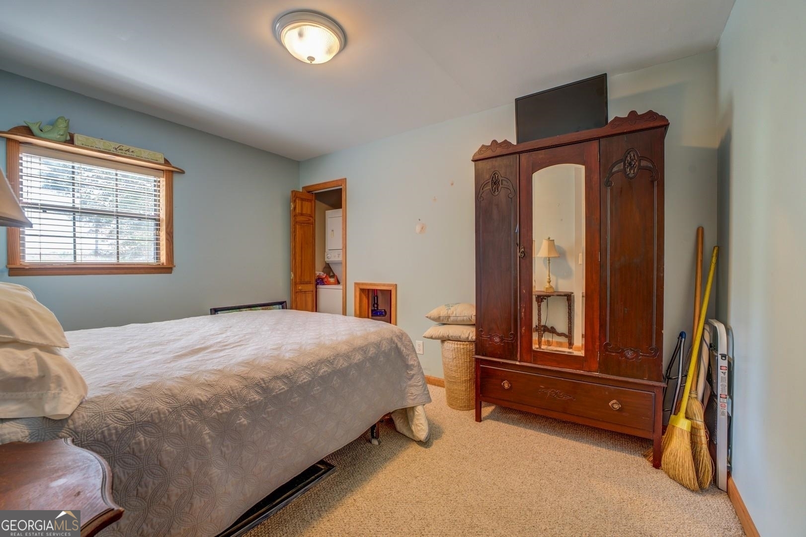 393 Templeton Road Mansfield, GA 30055 - Photo 30 of 54 a bedroom with a bed and a window