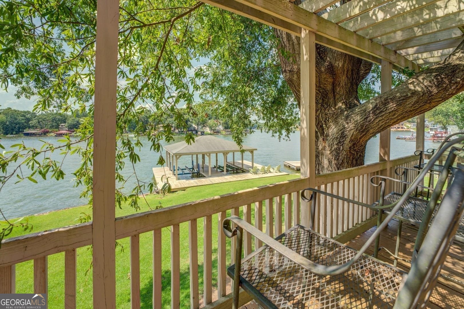 393 Templeton Road Mansfield, GA 30055 - Photo 42 of 54 a view of a balcony with floor to ceiling window and wooden fence