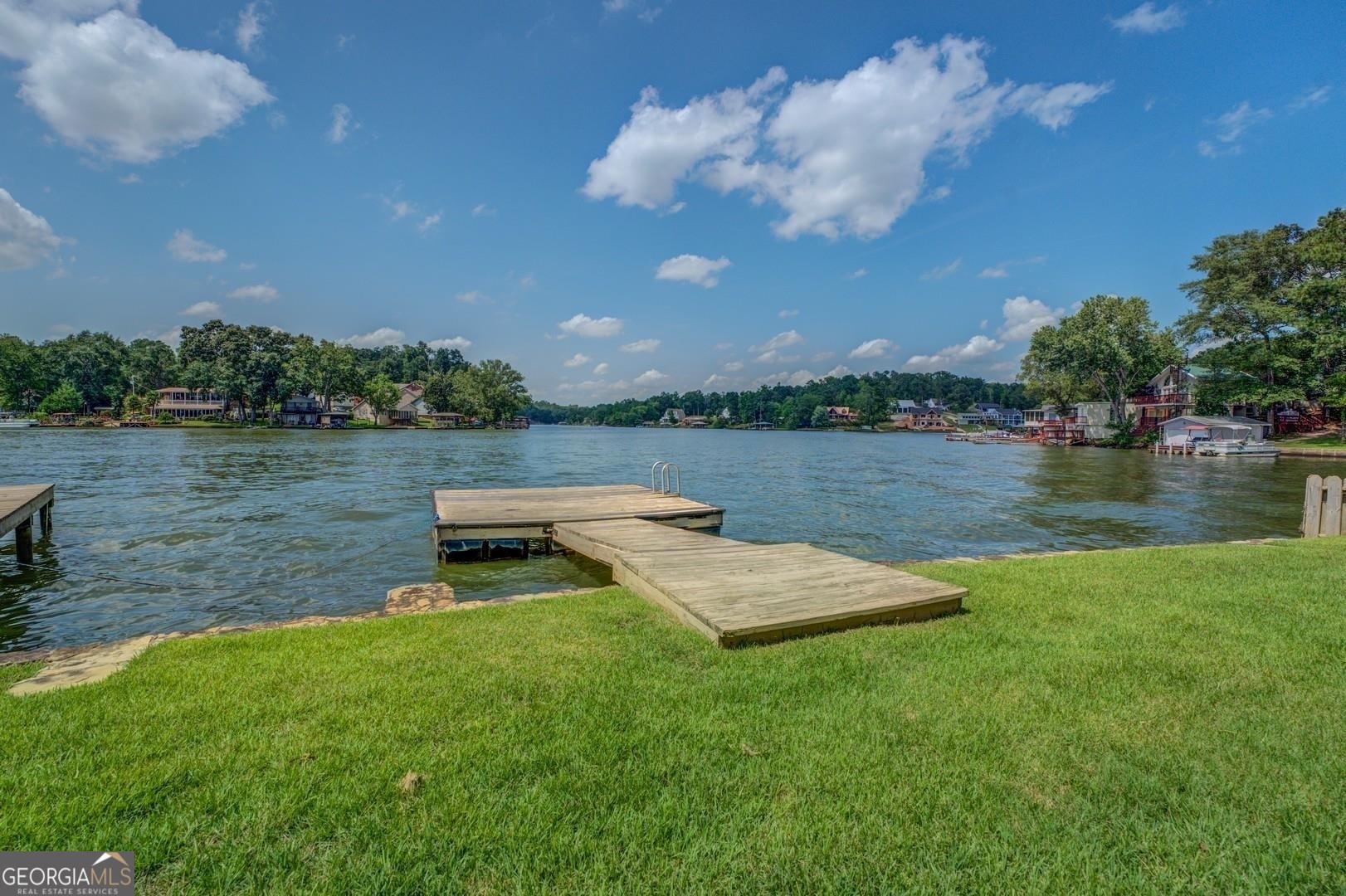 393 Templeton Road Mansfield, GA 30055 - Photo 44 of 54 a view of a lake with houses in the back