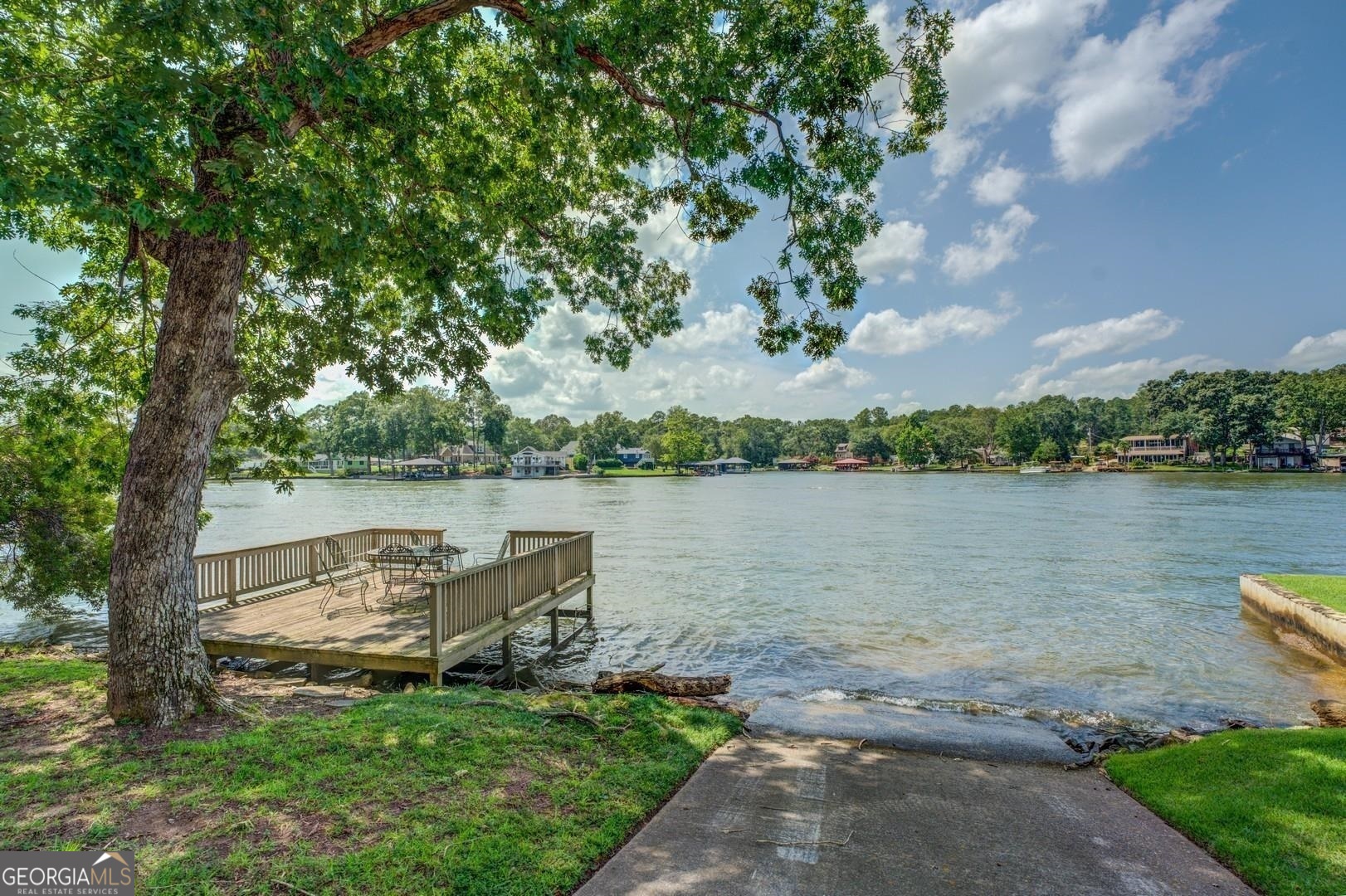 393 Templeton Road Mansfield, GA 30055 - Photo 47 of 54 a view of a lake with houses in the back