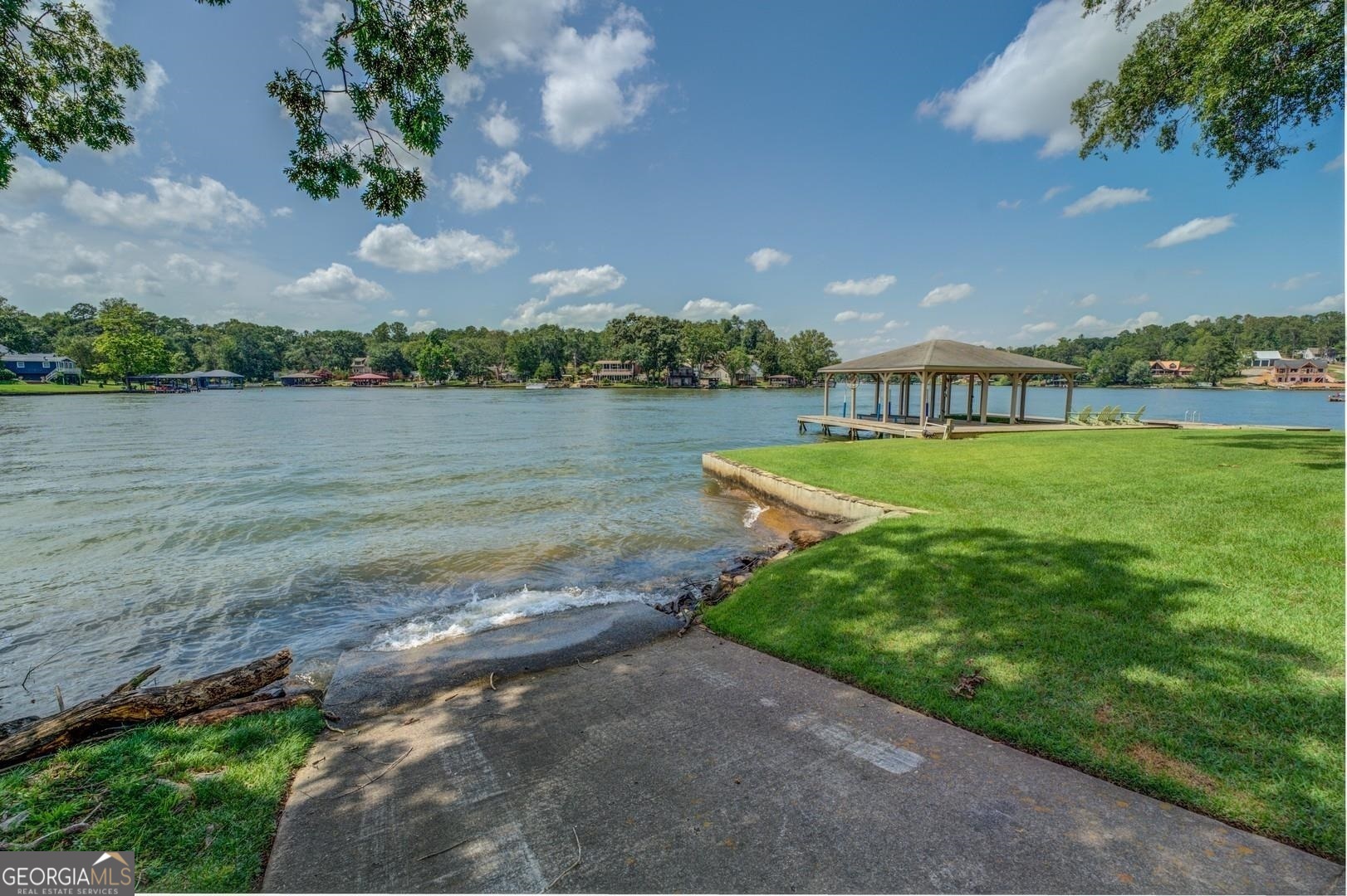 393 Templeton Road Mansfield, GA 30055 - Photo 10 of 54 a view of a lake with houses in the back